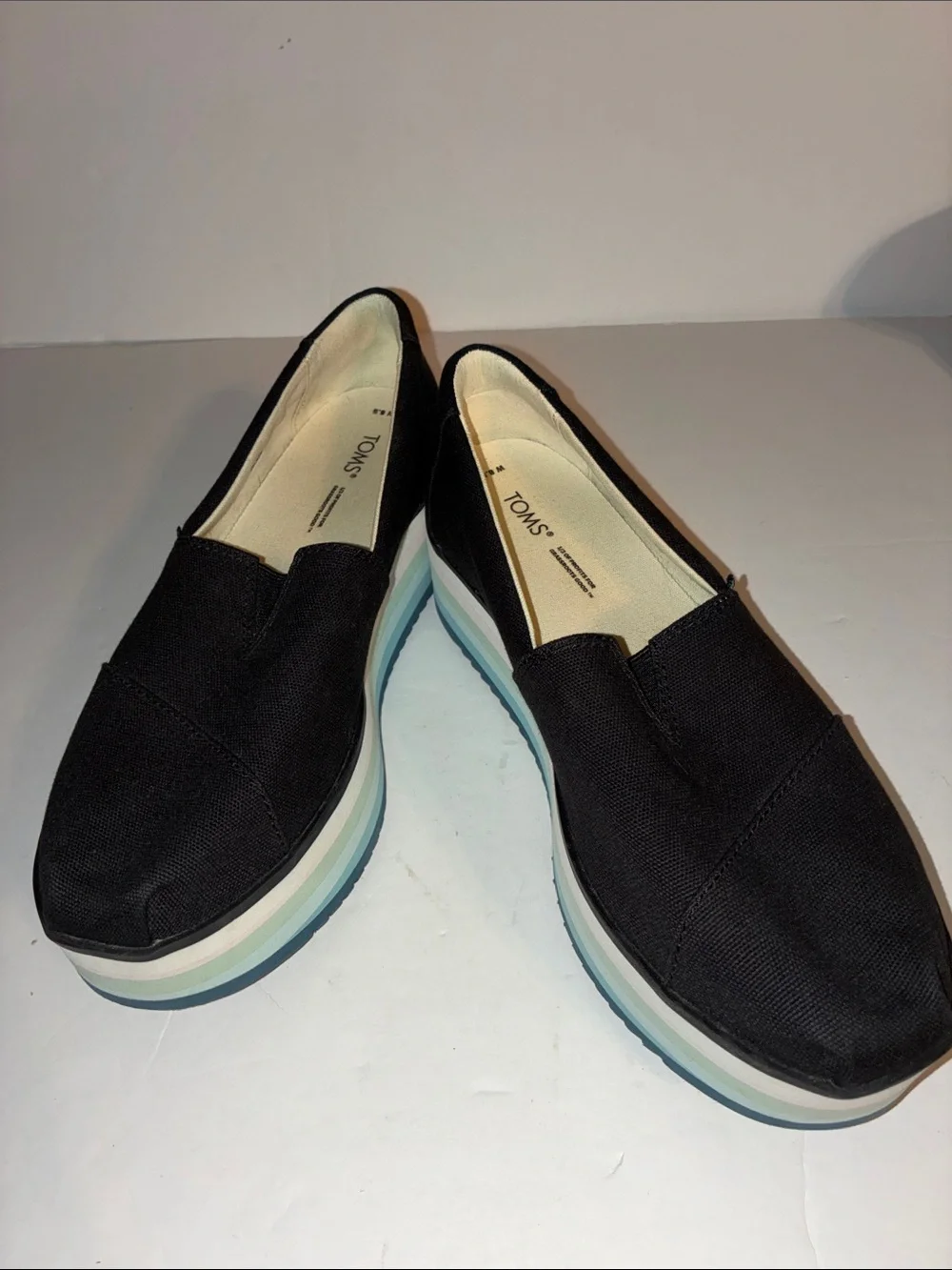 TOMS, Women’s 8.5, Black Canvas Platform Slip-Ons with Pastel Striped Sole
